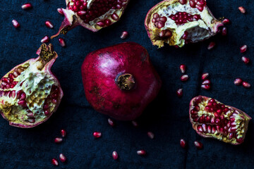 broken pomegranate on black background