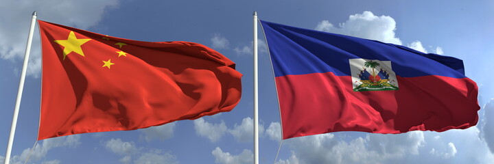 Flying flags of China and Haiti on sky background, 3d rendering