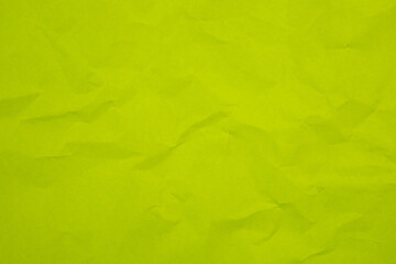 Close up of green wrinkle crumpled old with paper page texture rough background. crease grunge parchment pattern vintage design