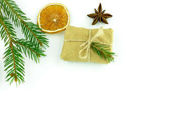 Christmas Happy New Year background. Spruce gift orange anise on white isolated background. View from above. Flat lay. Place for your text greeting