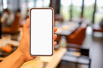 Women's hands holding cell telephone blank copy space screen. smartphone with blank white screen...