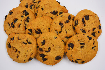 Very sweet shortbread cookie with chocolate pieces located on a white background. Ukrainian popular cookies, very satisfying with the taste of baked milk.