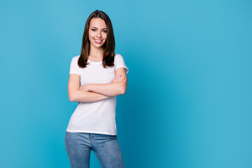Photo of pretty attractive business lady hold arms hands crossed worker successful career beaming smile top manager wear casual white t-shirt jeans isolated blue color background