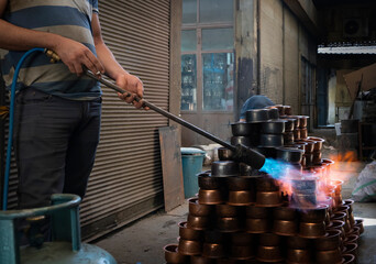 Copper production and fire given to copper pots with oxygen tube.