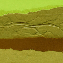 Colorful torn paper collage close-up. Texture made from various paper and cardboard parts. Damaged...