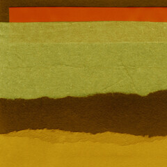 Colorful torn paper collage close-up. Texture made from various paper and cardboard parts. Damaged...