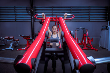 Portrait beauty sport woman wear sportwear posing under exercise with fitness equipment at gym ,she exercise for strong ,make muscle and good healthy