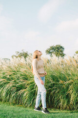 Young woman posing in the meadow