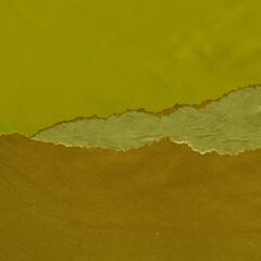 Green torn paper collage close-up. Texture made from various paper and cardboard parts. Damaged old...