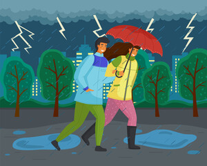 Family walks in autumn park. Girl in yellow puffer jacket, guy wears blue windbreaker, carries red umbrella. Fall landscape, lightning, ominous atmosphere. Dark landscape. Terrible lousy weather