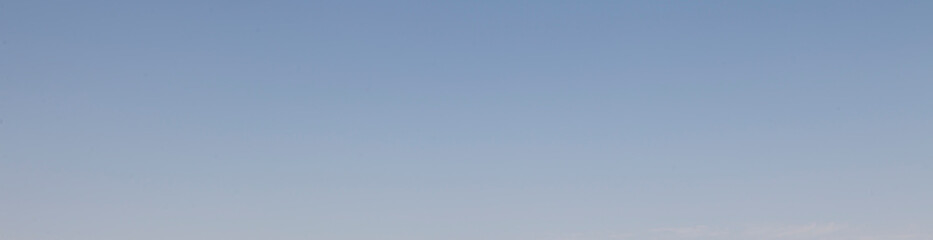 Image of a clear and cloudless sky can be used as background