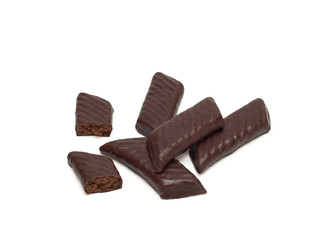 Top view of chocolate sweets filled with biscuit crumbs and condensed milk and cocoa isolated on white background