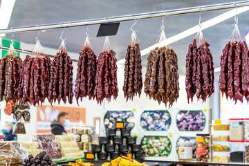 Oriental sweets, Georgian national food dessert, churchkhela with juice, sugar and nuts hanging on a display in a bazaar on sale