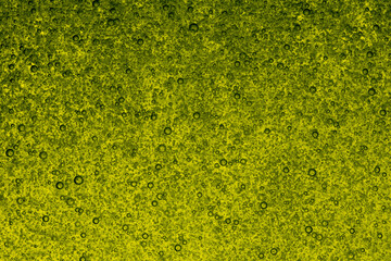 Small bubbles in green acidic liquid (abstraction)
