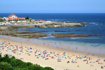 Sunny beach of Comillas on the Bay of Biscay, Cantabria, Spain