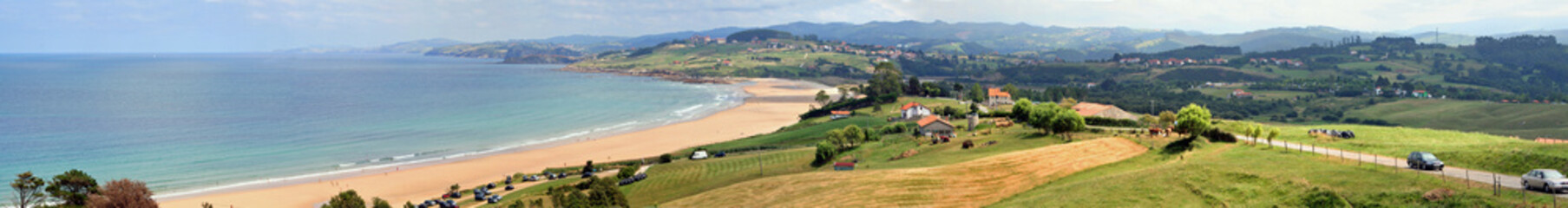 Fototapeta na wymiar View on Playa de Oyambre y la Rabia, located on the bay of Biscay, Cantabria, Spain.