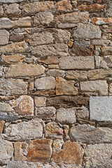 Architecture textures, detailed and rustic of paired masonry granite wall