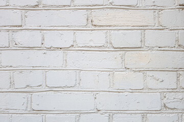 abstract background of an old brick wall painted white close up