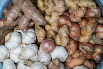Dry garlic, onion and ginger for sale at street food market in the old town of Hanoi, Vietnam