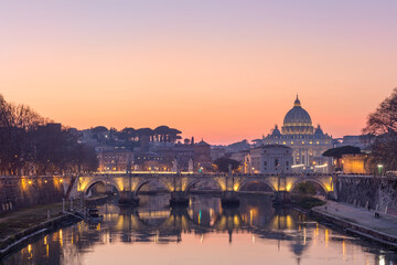 Naklejka na ściany i meble Sunset over the Vatican City in Rome, St. Peter Basilica, St. Angelo Bridge and Tevere River in Rome, Italy