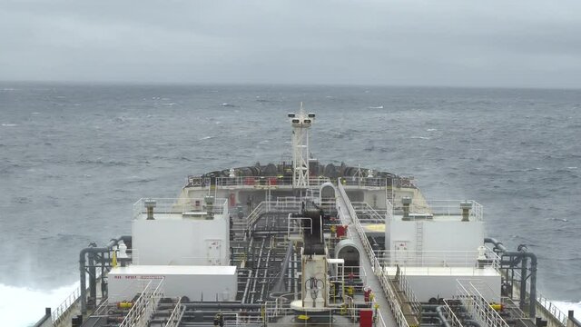 Deck of oil tanker underway in the sea.