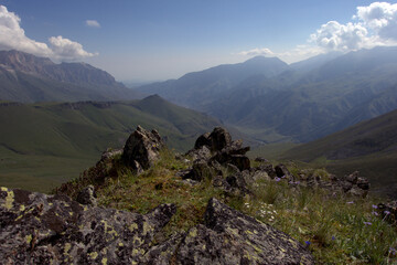 Fototapeta na wymiar Alpine landscape with mountain peaks and green valleys. Caucasus, Russia. 