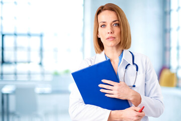 Female doctor portrait while standing in the clinic