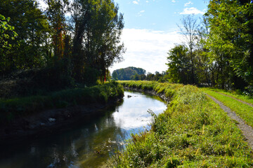view of a countryside landscape with river and wild nature