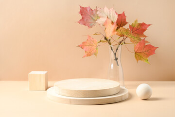 Stands for product of wooden materials. Cube, ball and plate as podium. Composition with autumn leaves on beige background.