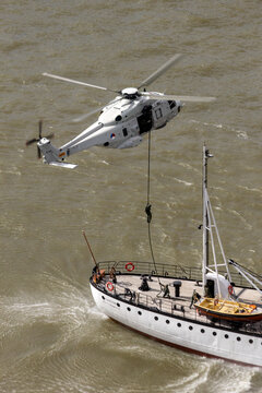 Anti-piracy demonstration with Dutch marines entering a vessel from a NH90 helicopter during the World Harbor Days in Rotterdam. ROTTERDAM, THE NETHERLANDS - SEP 15, 2015.
