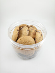 Brown chocolate chip cookies freshly baked on plastic container