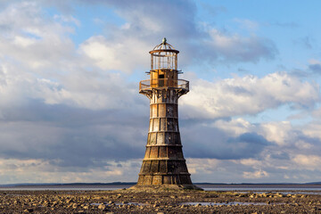 Whiteford Lighthouse is listed by Cadw as Grade II* A wave-swept cast-iron lighthouse in British...