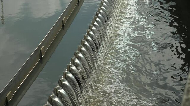 Sedimentation round tank  with rakes around. Detail of second step of sedimentation in modern city waste water treatment plant.