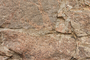 Old stone wall in daylight.