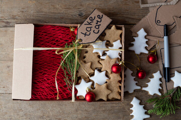 Christmas gifts packed furoshiki lie on a brown wooden table. zero waste concept
