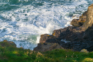 Waves crashing on the cliffs