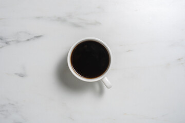 Cup of black coffee on marble