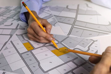 people discussing about territory building plots for sale on cadastral map