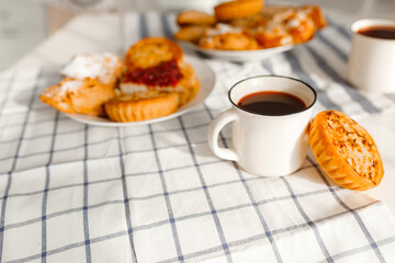 Appetizing rye flour pastries on a table on a linen towel with natural light