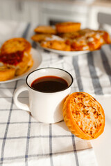 Appetizing rye flour pastries on a table on a linen towel with natural light