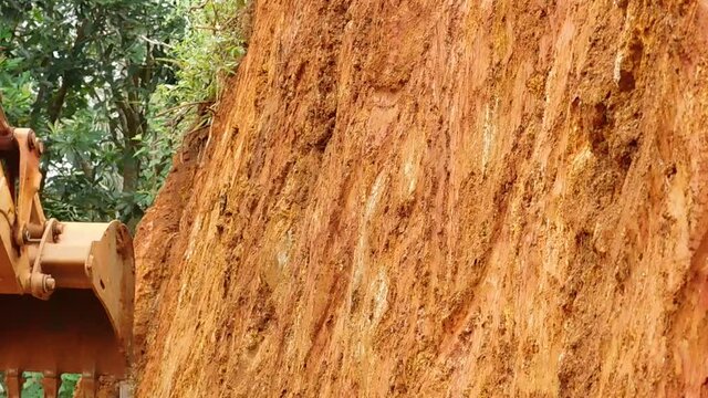 closeup of an earth mover (JCB) working on the earth surface