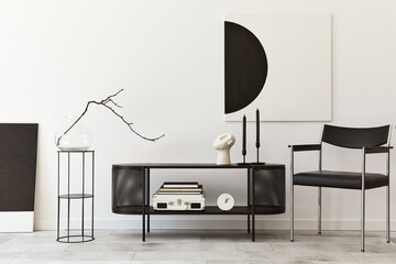 Interior design of modern living room with black stylish commode, chair, mock up art paintings,...