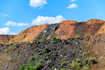 View of slag heaps of iron ore quarry. Mining industry