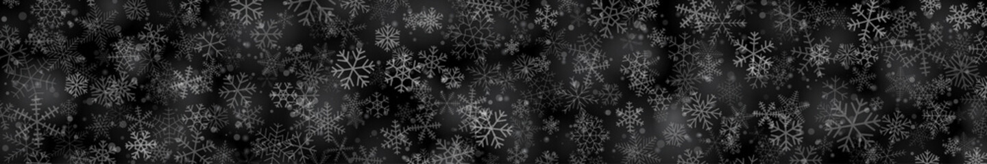 Obraz na płótnie Canvas Christmas banner of snowflakes of different shapes, sizes and transparency on black background