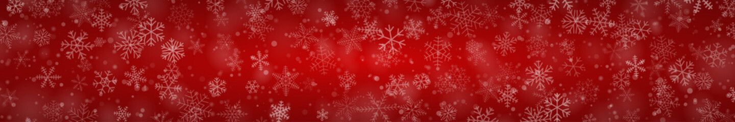 Christmas banner of snowflakes of different shapes, sizes and transparency on red background