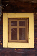 Vintage wooden window on a cabine with wooden boards around it