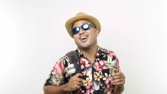 Funny crazy tourist with aloha shirt dancing on isolated white background. 4K Resolution.