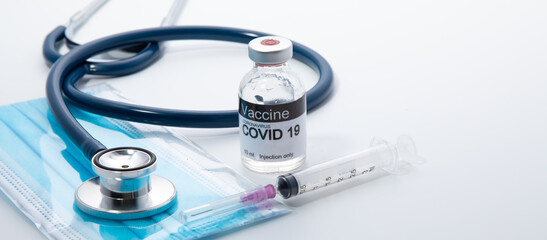Healthcare and medical background concept. COVID 19 vaccine or Coronavirus vaccine with needle,...