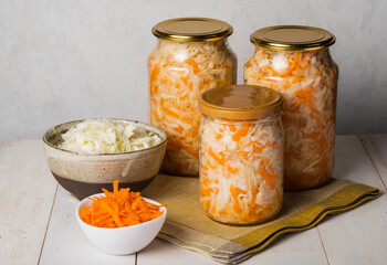 Sauerkraut in a glass jars and plate.  The best natural probiotic. Fermented product 