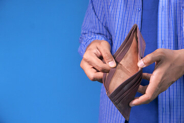 Man hand open an empty wallet with copy space.